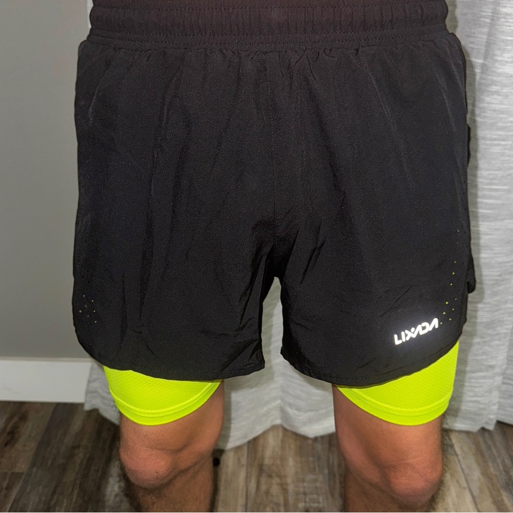Running shorts with compression shorts underneath (black on top of green)